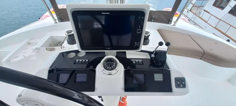 Amea Yacht Photos Pics Helm station of 2014 Lagoon 52 F catamaran with navigation equipment and controls.