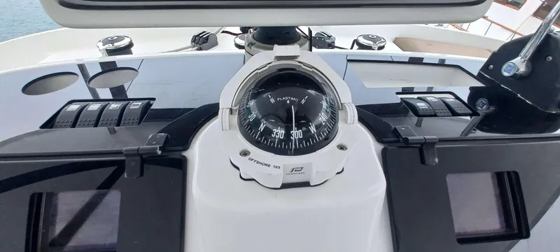 Amea Yacht Photos Pics Compass on Lagoon 52 F yacht dashboard, 2014 model, with navigation controls.