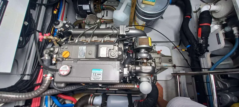 Amea Yacht Photos Pics Engine room of a 2014 Lagoon 52 F catamaran, showcasing detailed mechanical components.