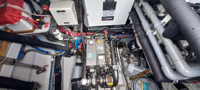 Amea Yacht Photos Pics Engine room of a 2014 Lagoon 52 F yacht, showcasing mechanical components and wiring.