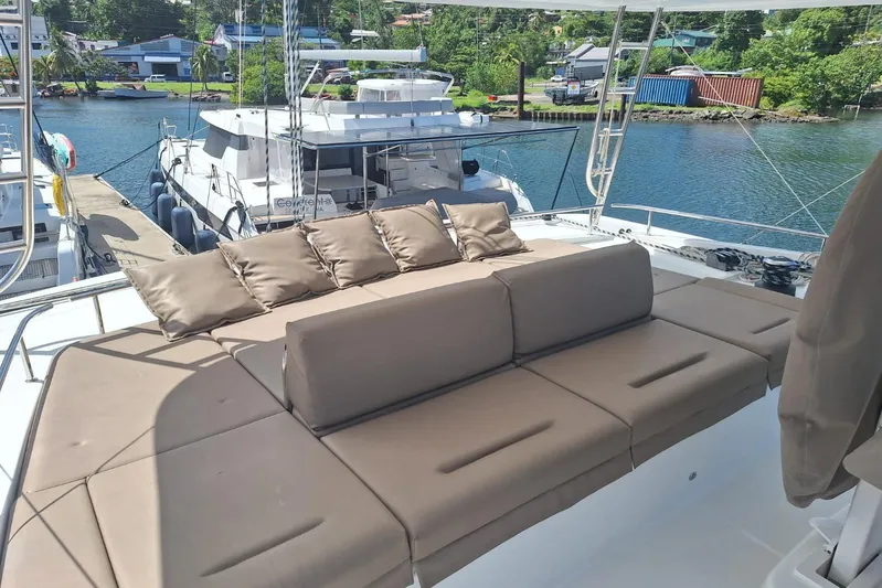 Amea Yacht Photos Pics Luxurious seating area on a 2014 Lagoon 52 F yacht, docked at a marina.