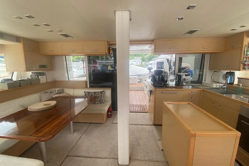 Amea Yacht Photos Pics Interior of 2014 Lagoon 52 F yacht with modern kitchen and dining area.