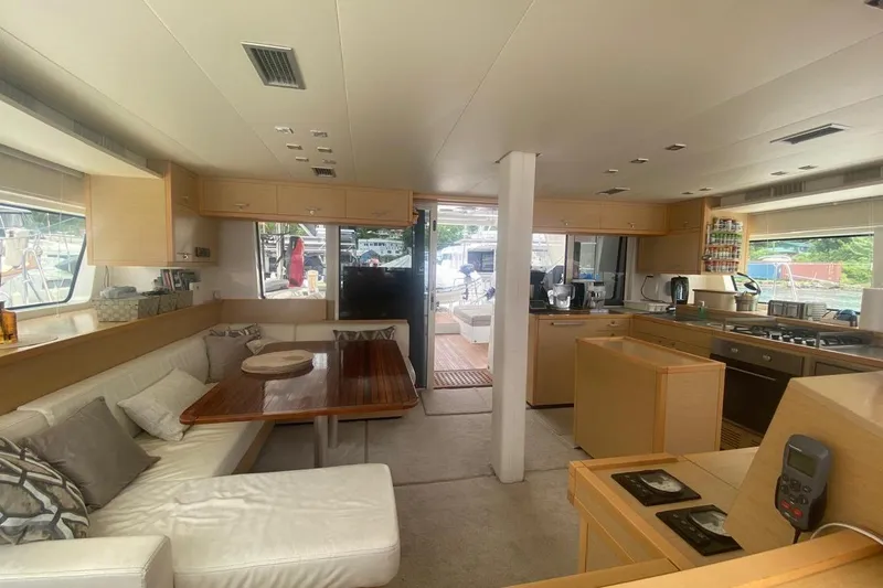 Amea Yacht Photos Pics Interior of 2014 Lagoon 52 F yacht, featuring modern kitchen and cozy seating area.