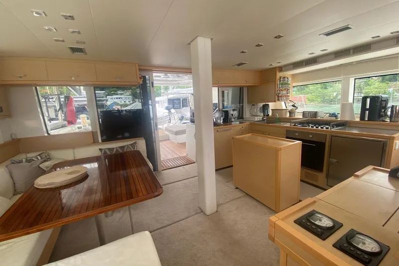 Amea Yacht Photos Pics Interior of 2014 Lagoon 52 F yacht with modern kitchen and dining area.