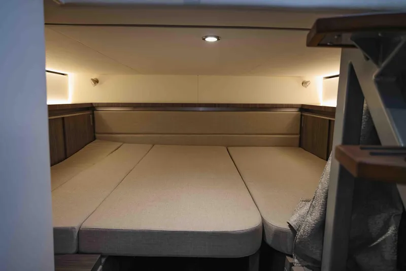  Yacht Photos Pics 2023 Sea Ray Sundancer 320 Coupe cabin interior with cozy bed and modern lighting.