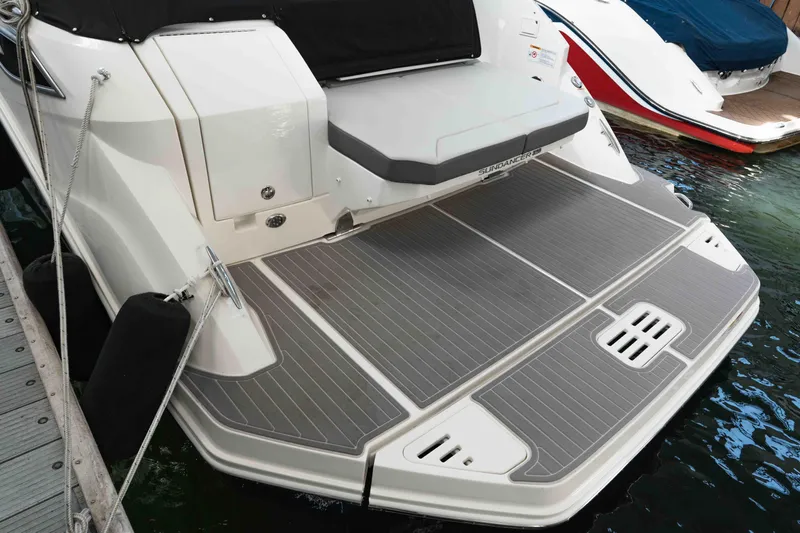  Yacht Photos Pics 2023 Sea Ray Sundancer 320 Coupe swim platform, docked, showcasing sleek design and modern features.