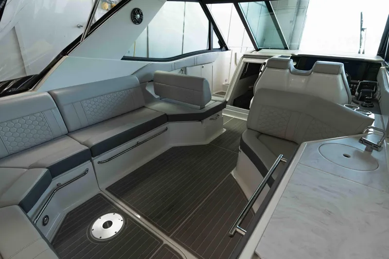  Yacht Photos Pics 2023 Sea Ray Sundancer 320 Coupe interior with luxurious seating and modern design.