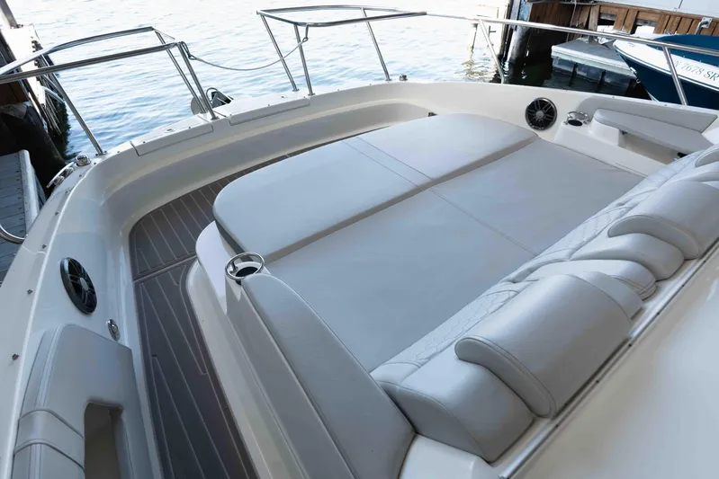  Yacht Photos Pics 2023 Sea Ray Sundancer 320 Coupe's spacious deck with cushioned seating and sleek design.