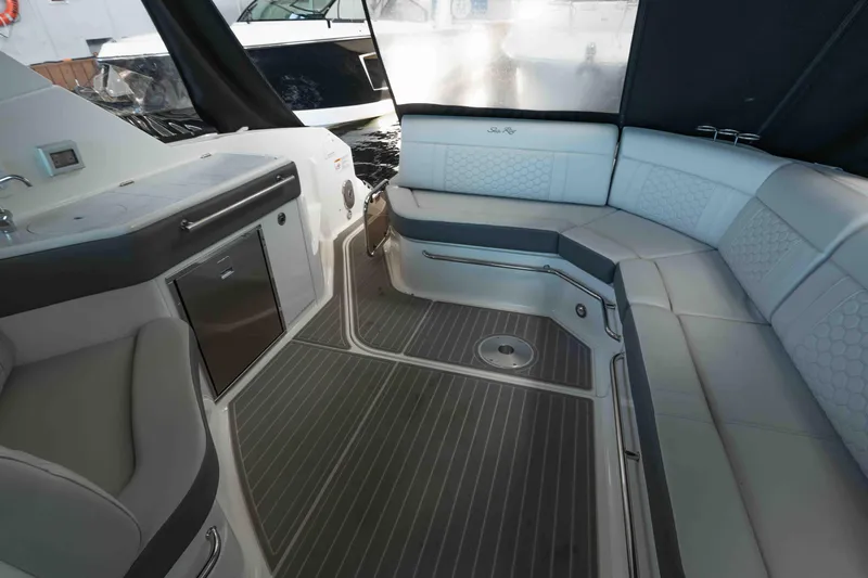  Yacht Photos Pics 2023 Sea Ray Sundancer 320 Coupe interior with sleek seating and modern amenities.