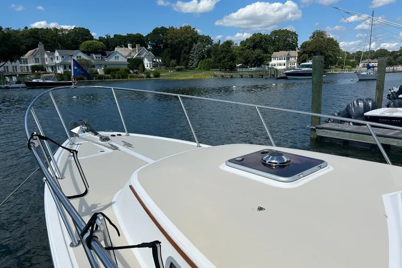  Yacht Photos Pics 2005 Hunt Yachts Surfhunter 33 docked in a scenic waterfront setting.