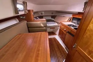 Yacht Photos Pics 2005 Hunt Yachts Surfhunter 33 interior with wood finishes and cozy seating area.