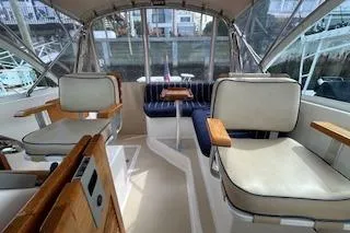  Yacht Photos Pics 2005 Hunt Yachts Surfhunter 33 interior with seating and wooden accents.