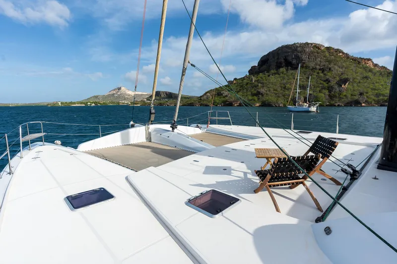 Orion Yacht Photos Pics Catana 90 catamaran deck with scenic ocean view, 2008 model, featuring a relaxing chair.