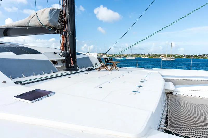 Orion Yacht Photos Pics Catana 90 catamaran deck, 2008 model, sailing on blue ocean under clear sky.