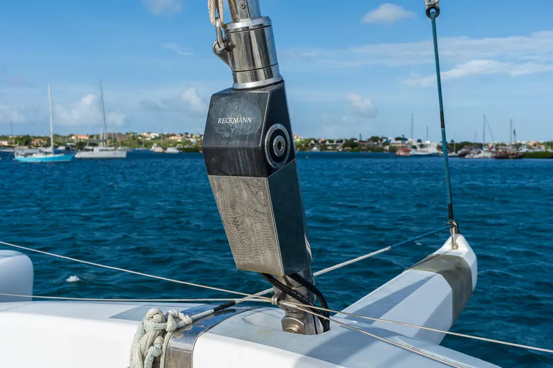 Orion Yacht Photos Pics Close-up of Catana 90 sailboat rigging against a scenic harbor backdrop, 2008 model.