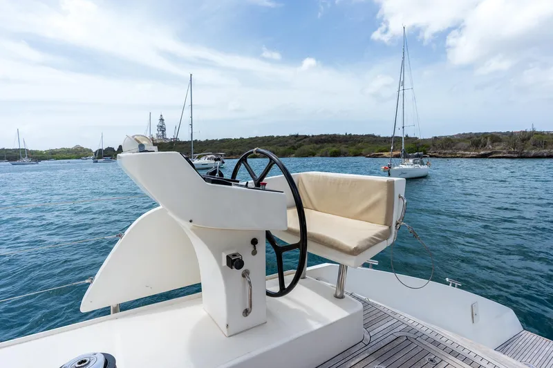 Orion Yacht Photos Pics Helm of 2008 Catana Catana 90 yacht with scenic ocean view.