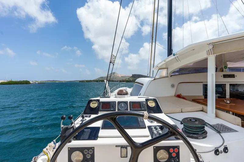 Orion Yacht Photos Pics Catana 90 catamaran sailing on blue waters, 2008 model, with clear sky and scenic view.