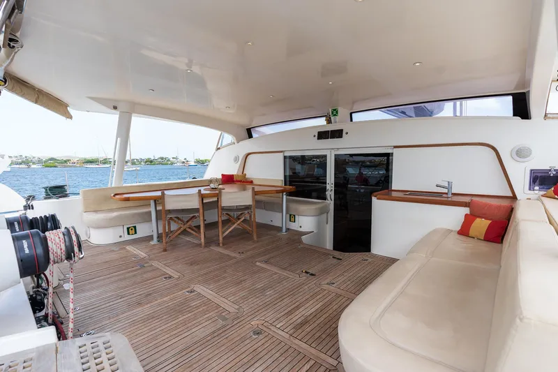 Orion Yacht Photos Pics Luxurious Catana 90 yacht deck with seating and dining area, 2008 model.