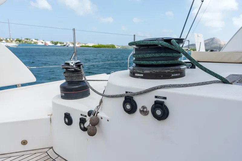 Orion Yacht Photos Pics Catana 90 sailboat deck with winches and ropes, 2008 model, on a sunny day at sea.