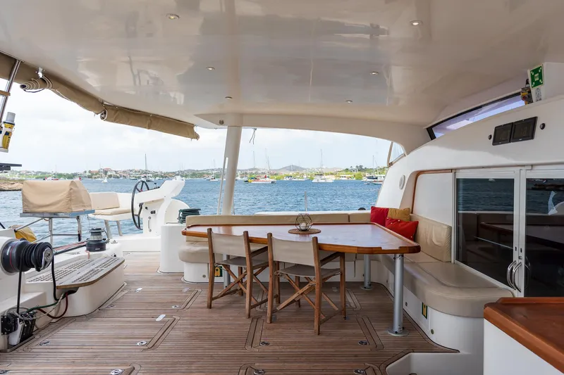 Orion Yacht Photos Pics Spacious deck of 2008 Catana 90 yacht with seating and ocean view.