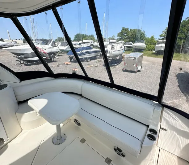  Yacht Photos Pics Interior of 2006 Cruisers Yachts 420 Express with white seating and marina view.