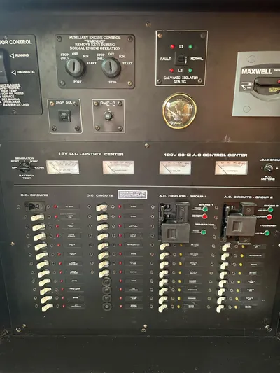  Yacht Photos Pics Electrical control panel of 2006 Cruisers Yachts 420 Express, featuring various switches and gauges.