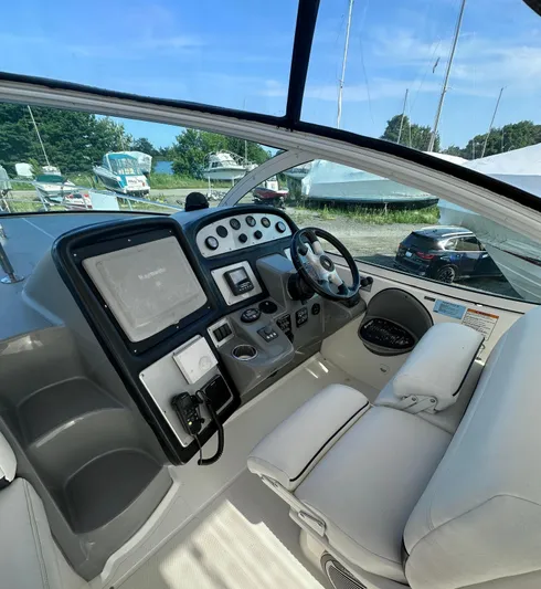  Yacht Photos Pics 2006 Cruisers Yachts 420 Express helm with modern controls and comfortable seating.