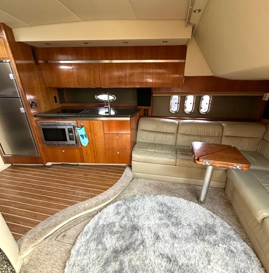  Yacht Photos Pics Interior of 2006 Cruisers Yachts 420 Express with kitchen and seating area.