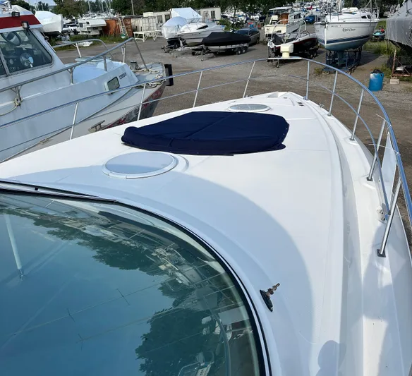  Yacht Photos Pics 2006 Cruisers Yachts 420 Express on dry dock, showcasing sleek deck design.