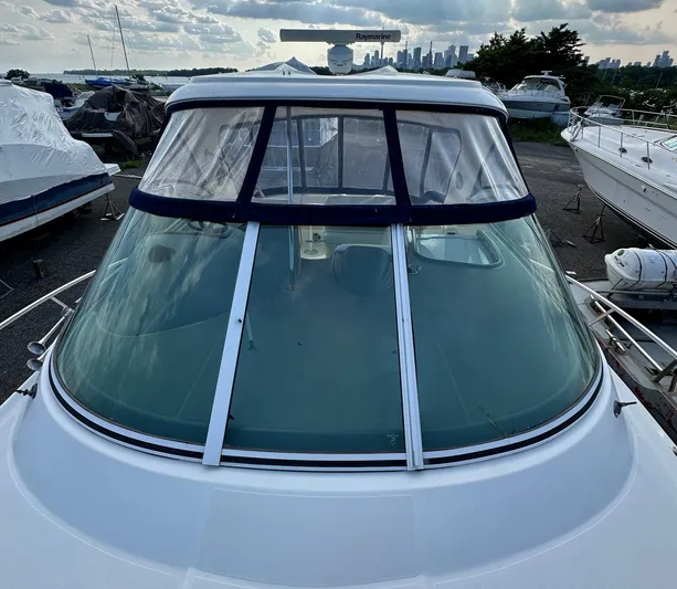  Yacht Photos Pics 2006 Cruisers Yachts 420 Express with clear windshield, docked in a marina.