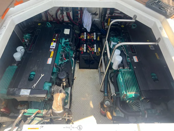  Yacht Photos Pics Engine compartment of 2006 Cruisers Yachts 420 Express, featuring dual engines and battery setup.