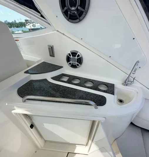  Yacht Photos Pics 2006 Cruisers Yachts 420 Express interior with sleek countertop and built-in cup holders.