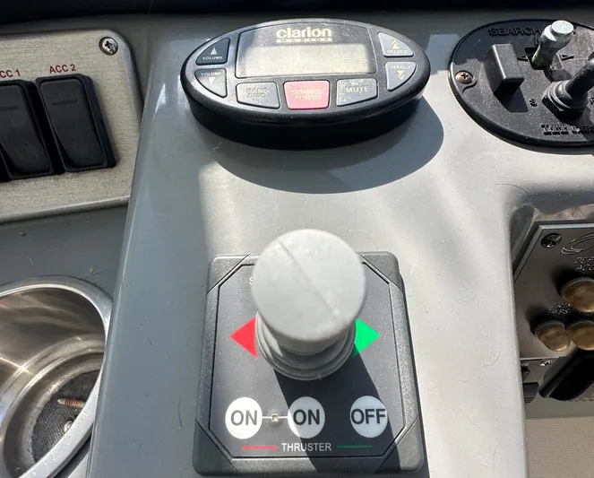  Yacht Photos Pics Control panel of 2006 Cruisers Yachts 420 Express with thruster and audio controls.