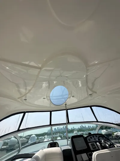  Yacht Photos Pics Interior view of 2006 Cruisers Yachts 420 Express with helm and skylight.