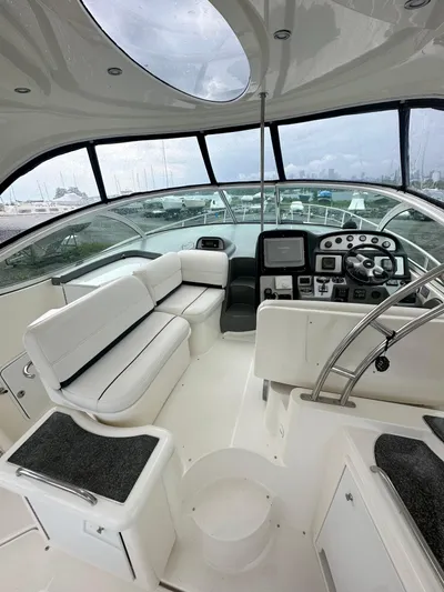  Yacht Photos Pics 2006 Cruisers Yachts 420 Express cockpit with white seating and modern dashboard.