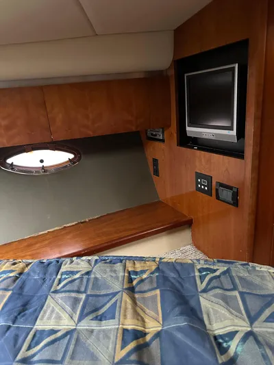  Yacht Photos Pics 2006 Cruisers Yachts 420 Express cabin interior with TV and porthole.