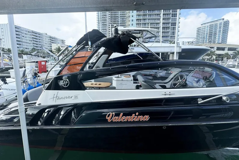  Yacht Photos Pics 2024 Hanover 305 boat named Valentina docked at a marina.