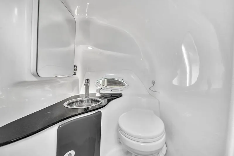  Yacht Photos Pics Modern bathroom interior in 2024 Hanover 305, featuring sleek sink and toilet design.