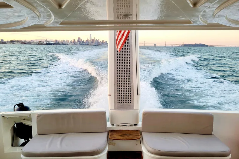 Mi Amore Yacht Photos Pics Ferretti Yachts 550 cruising with city skyline and bridge in the background, 2006 model.