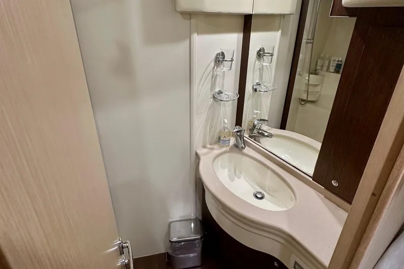Mi Amore Yacht Photos Pics Bathroom interior of 2006 Ferretti Yachts 550, featuring a modern sink and mirror.