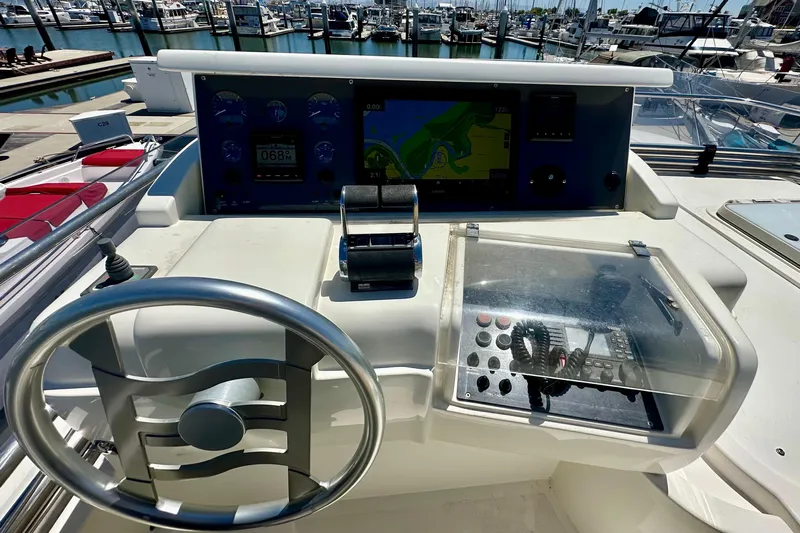 Mi Amore Yacht Photos Pics Helm of 2006 Ferretti Yachts 550 with navigation controls and marina view.
