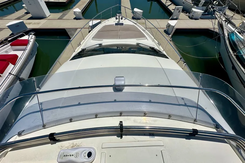 Mi Amore Yacht Photos Pics 2006 Ferretti Yachts 550 docked at marina, top view of deck and surroundings.