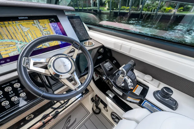  Yacht Photos Pics 2019 Sea Ray SLX 400 Outboard helm with steering wheel and navigation display.