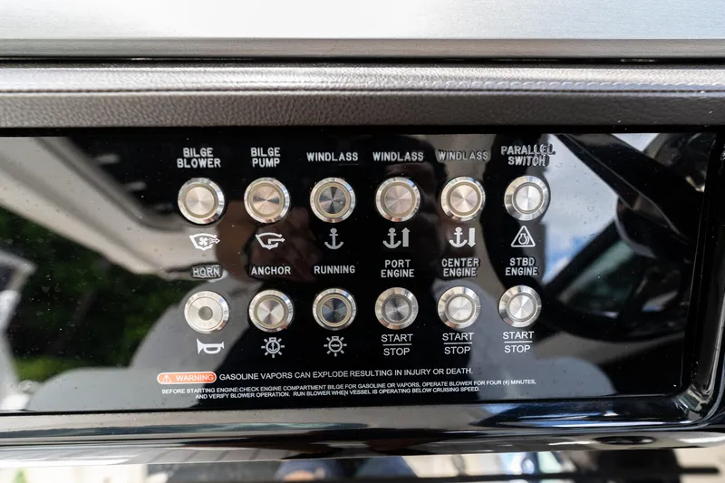  Yacht Photos Pics Control panel of a 2019 Sea Ray SLX 400 Outboard boat with various switches.
