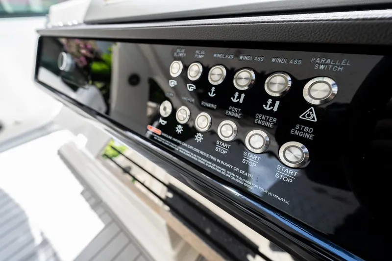  Yacht Photos Pics Control panel of 2019 Sea Ray SLX 400 Outboard boat with various engine and system buttons.