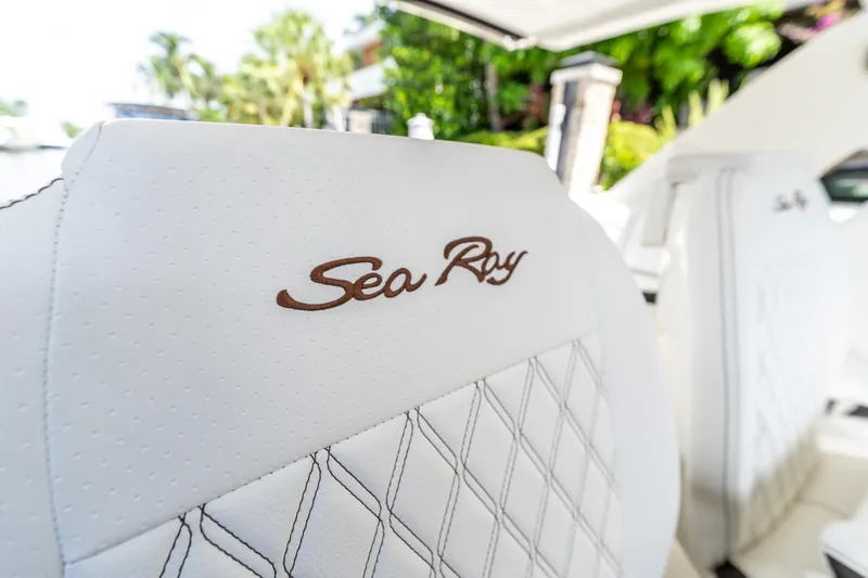  Yacht Photos Pics White leather seat with "Sea Ray" logo on 2019 SLX 400 Outboard boat.