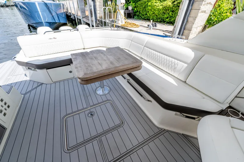  Yacht Photos Pics Luxurious seating area on 2019 Sea Ray SLX 400 Outboard with elegant table and sleek design.