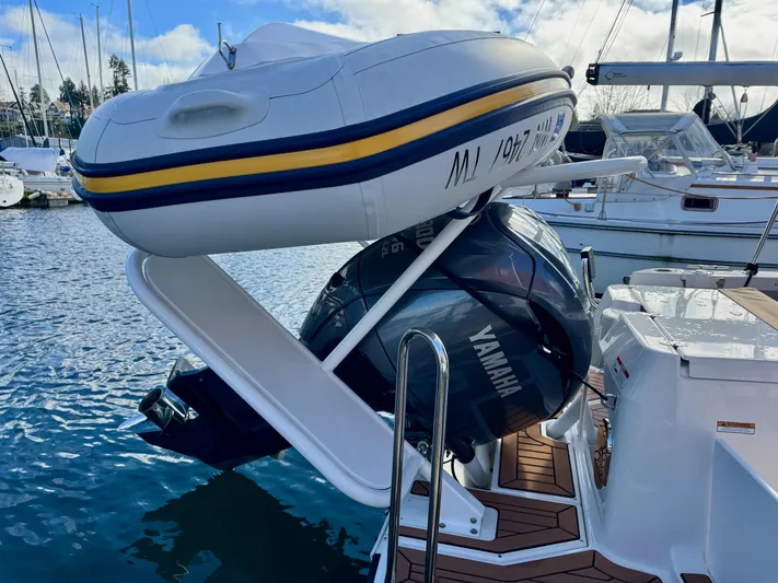  Yacht Photos Pics 2024 Ranger Tugs R-27 with Yamaha engine and dinghy, docked at marina.