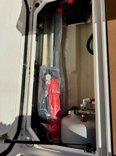  Yacht Photos Pics 2024 Ranger Tugs R-27 storage compartment with equipment and wiring.