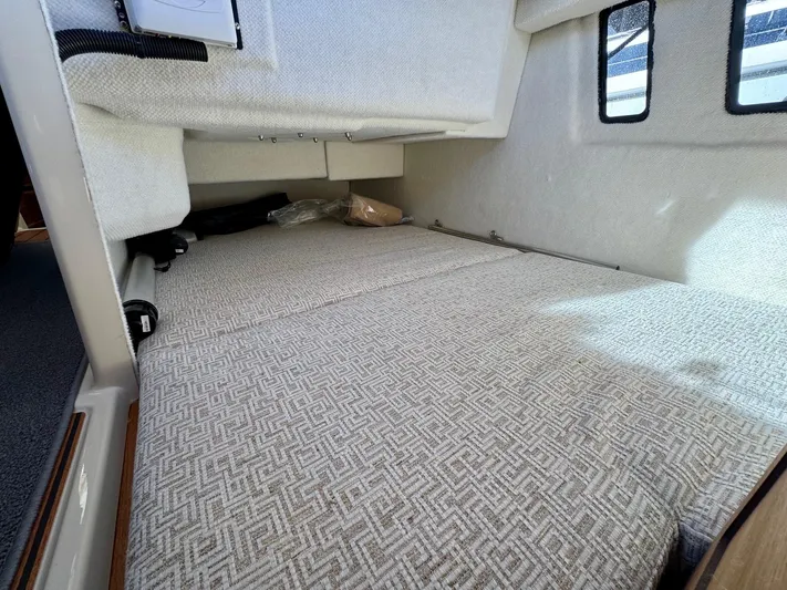  Yacht Photos Pics 2024 Ranger Tugs R-27 interior cabin with patterned upholstery and windows.